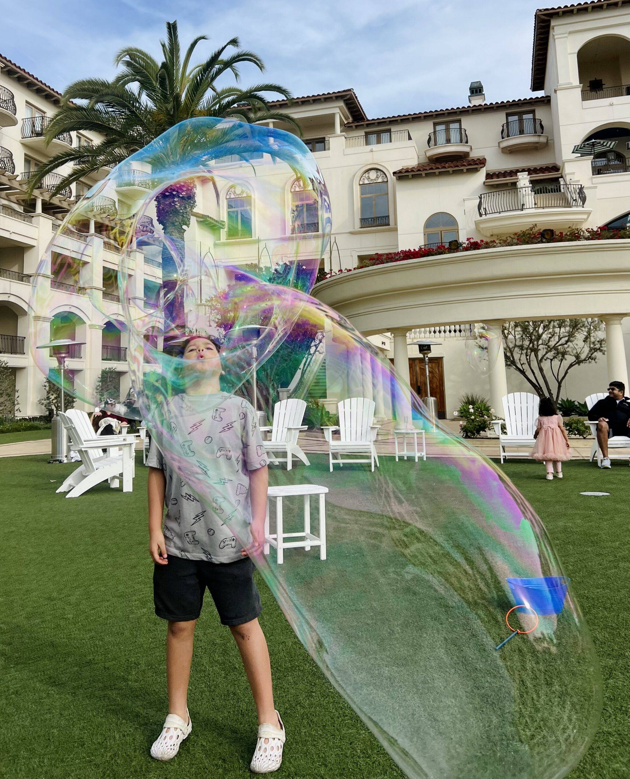 boy playing giant bubble